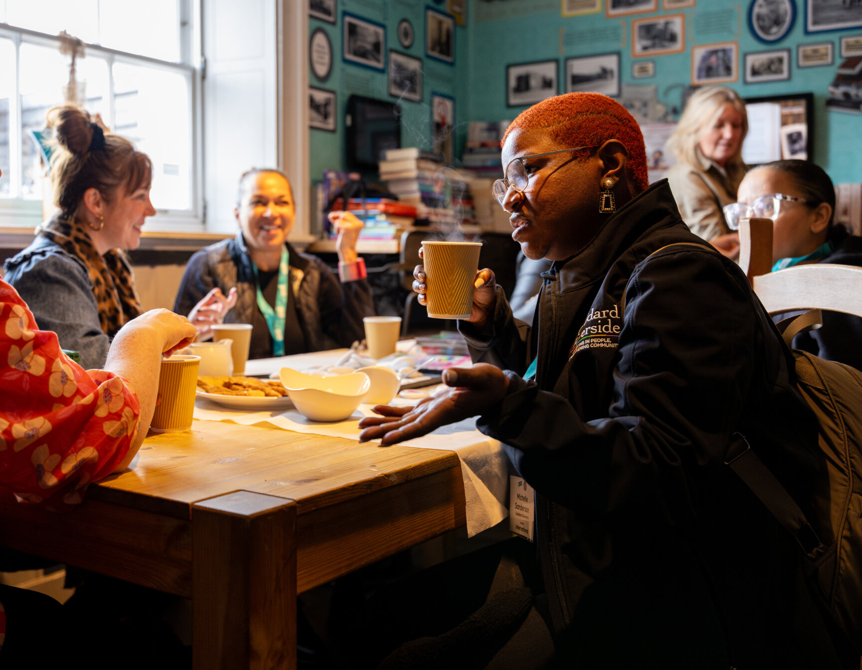 A table of people chatting in a cafe