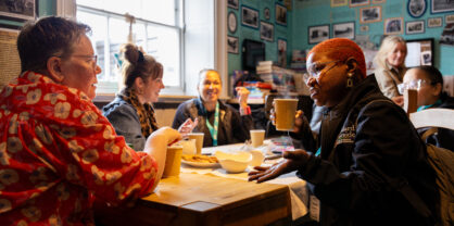 A table of people chatting in a cafe