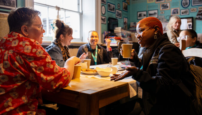 A table of people chatting in a cafe