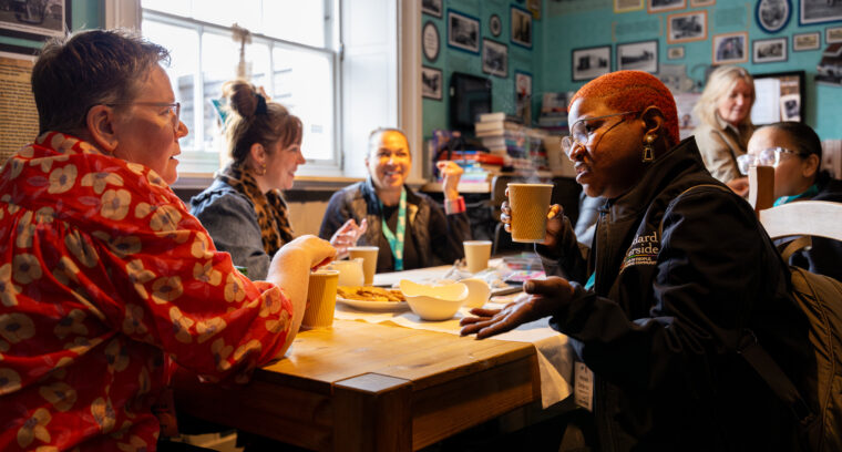 A table of people chatting in a cafe